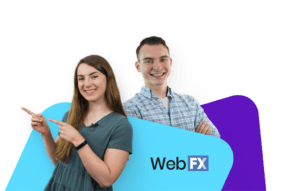 Two smiling marketers posing next to the WebFX logo on abstract shapes.
