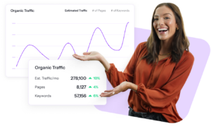 a woman holds up a graph showing organic traffic